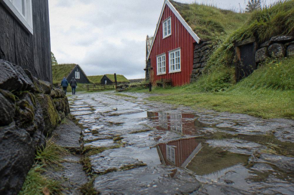 Wet cobblestone street in old Reykjavik with reflections after rain
