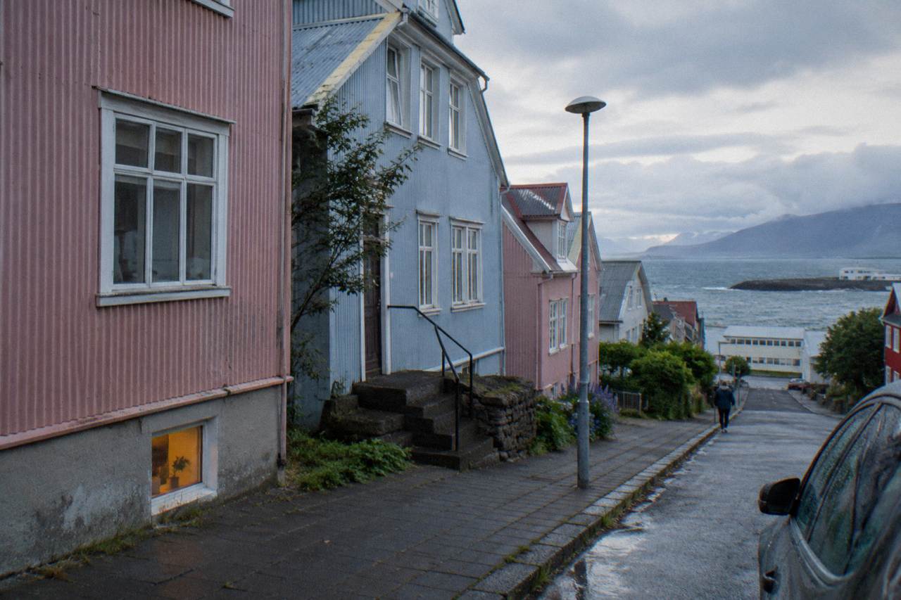 Quiet Reykjavik street with colored corrugated iron houses in soft early light