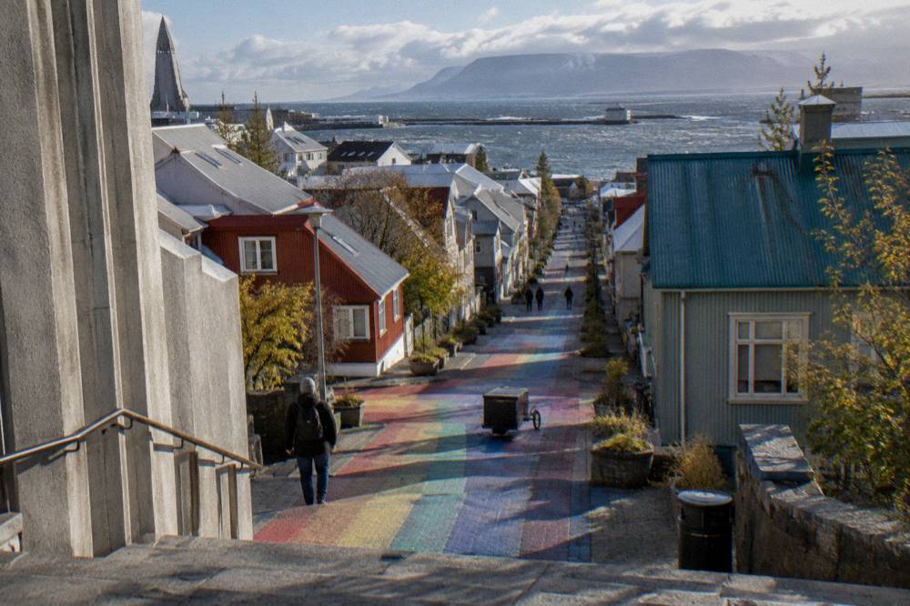 Skolavordustigur rainbow street in morning light leading up to Hallgrimskirkja tower
