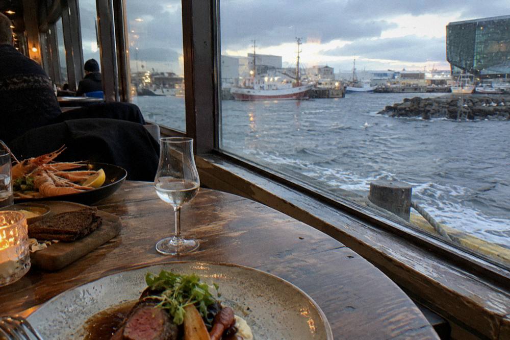 Tasting plates of Icelandic food arranged on a wooden restaurant table