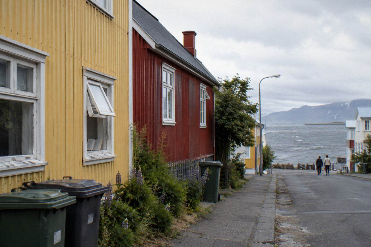 Colourful corrugated iron houses on a quiet Reykjavik street under a soft sky