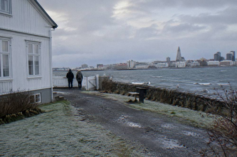 A quiet residential street of turf and timber houses near central Reykjavik