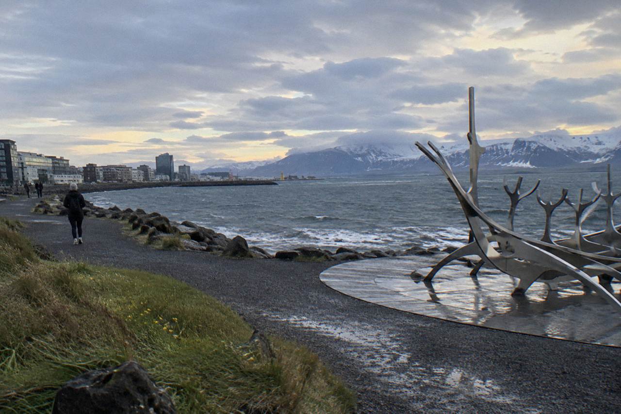 Bicycle lane along the Reykjavik seafront with the Sun Voyager sculpture and mountains across the water