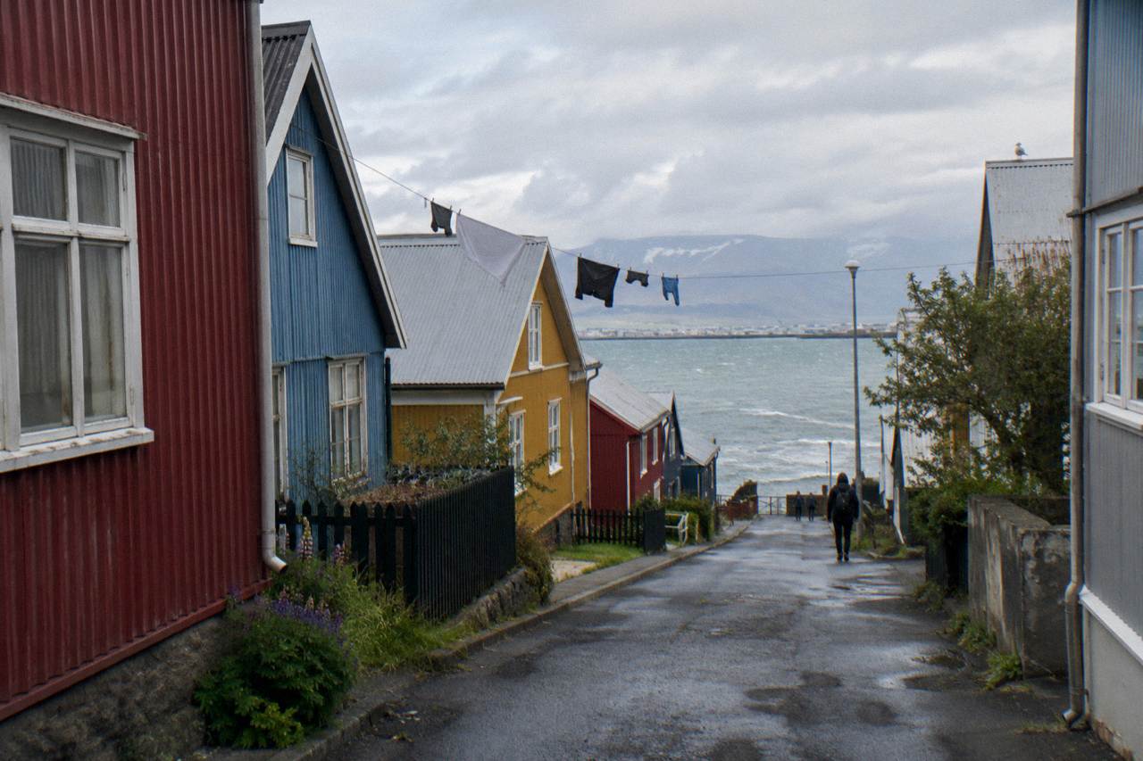 Colourful corrugated iron houses along a quiet Reykjavik street on an overcast day