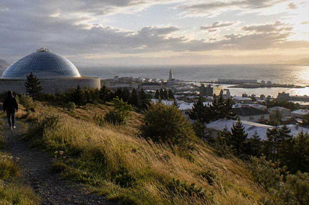 Golden twilight light over Reykjavik rooftops and harbour late in the evening