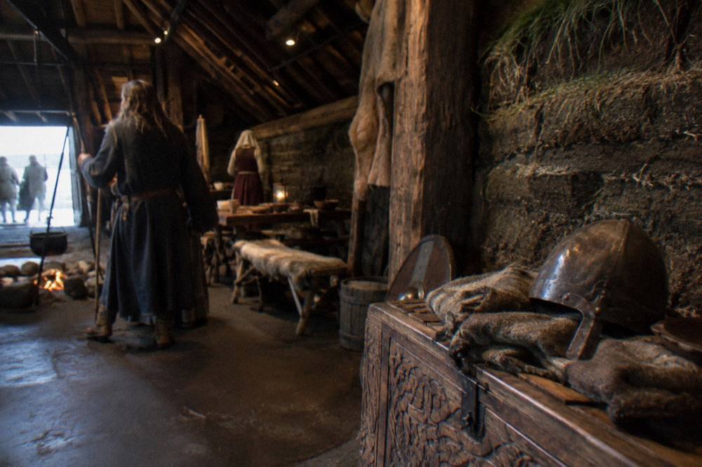 Wax figure scenes inside a dimly lit Icelandic saga museum