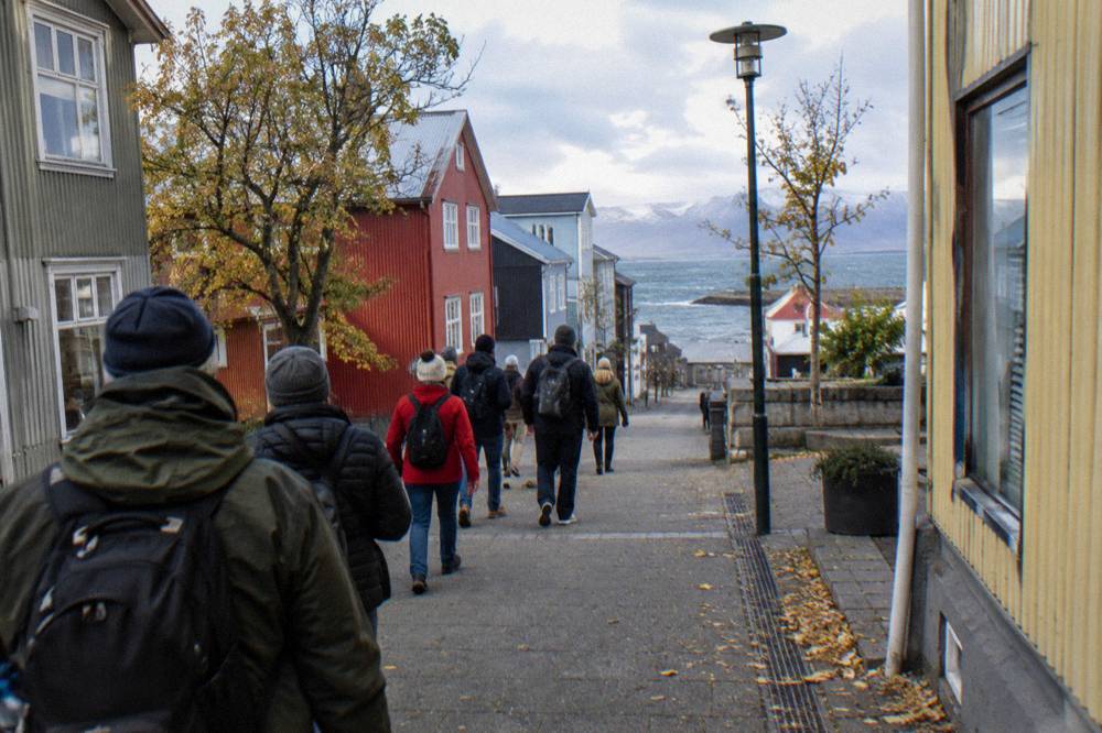 Guided walking group gathered on a pedestrian street in central Reykjavik