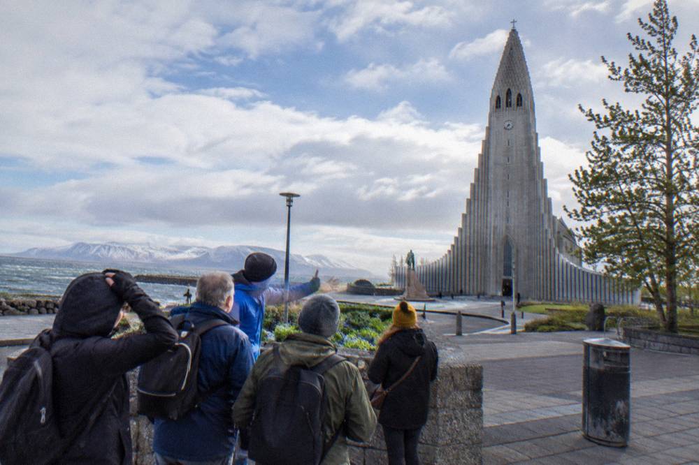 Guided walking group gathered on a Reykjavik street corner